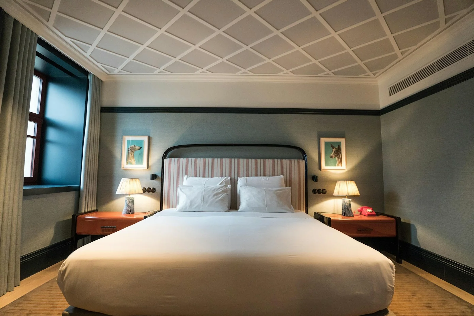 A calm double bedroom with a large bed and bedside lamps
